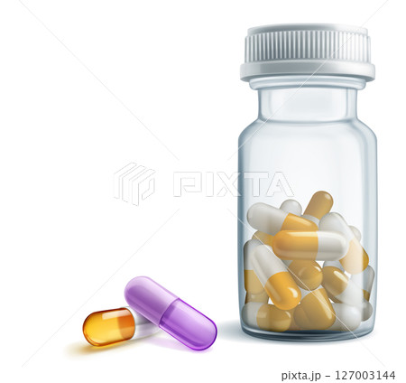 A bottle of pills with two capsules outside. A bottle of pills with two capsules outside. 127003144