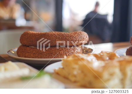 Freshly baked simit bread with sesame seeds on display Freshly baked simit bread with sesame seeds on display 127003325