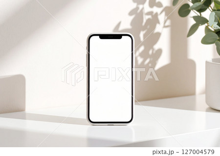シンプルでおしゃれなスマホのモックアップ (白い画面・縦向き) 127004579