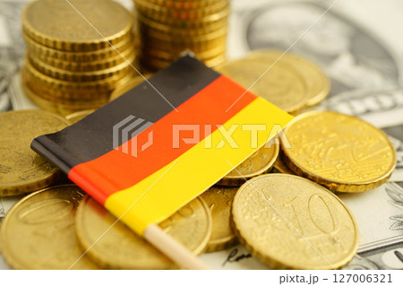 Germany flag on coin and banknote money, finance trading investment business currency concept. 127006321