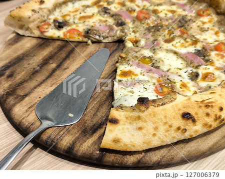 Delicious Pizza Topped with Ham and Vegetables Delicious Pizza Topped with Ham and Vegetables 127006379