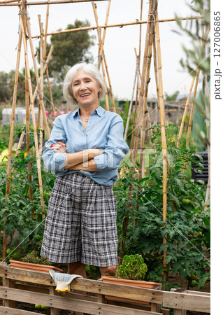 Mature woman at kitchen-garden Mature woman at kitchen-garden 127006865