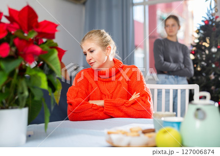 Upset adult woman ignoring her daughter 127006874