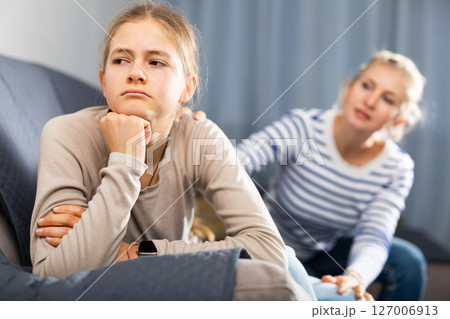 Sad teen girl after discord with her mother Sad teen girl after discord with her mother 127006913