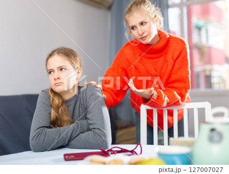 Sad teen girl after discord with her mother Sad teen girl after discord with her mother 127007027