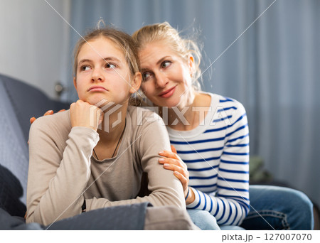 Sad teen girl after discord with her mother Sad teen girl after discord with her mother 127007070