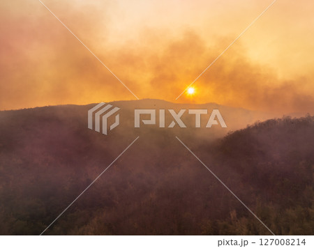 Wildfires release carbon dioxide (CO2) emissions and other greenhouse gases (GHG) that contribute to climate change. 127008214