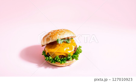 Tasty burger on isolated pink background Tasty burger on isolated pink background 127010923