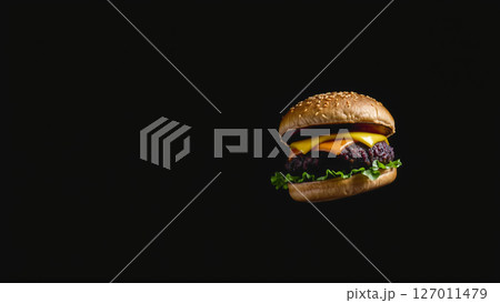 Great burger on a dark isolated phone 127011479