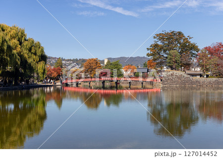 Red wooden bridge near Matsumoto Castle in Nagano, Japan Red wooden bridge near Matsumoto Castle in Nagano, Japan 127014452
