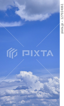 Blue sky with voluminous fluffy clouds. Thunderstorm over the river. Blue sky with voluminous fluffy clouds. Thunderstorm over the river. 127014861