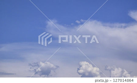Blue sky with voluminous fluffy clouds. Thunderstorm over the river. Blue sky with voluminous fluffy clouds. Thunderstorm over the river. 127014864
