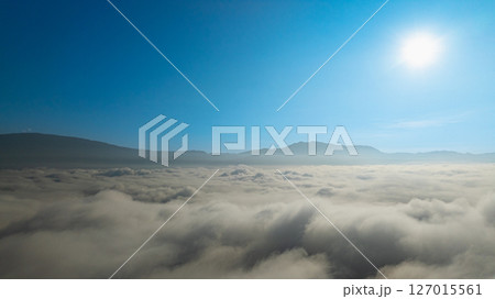 Aerial view of beautiful sunrise above the sea of mist Aerial view of beautiful sunrise above the sea of mist 127015561