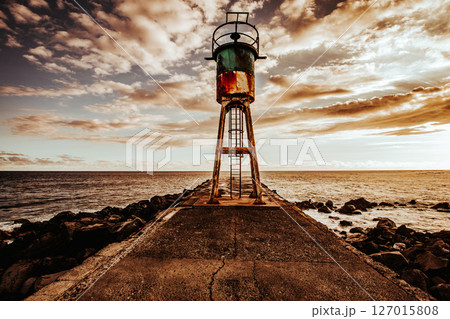 Jetty and lighthouse in Saint-Pierre, La Reunion island Jetty and lighthouse in Saint-Pierre, La Reunion island 127015808