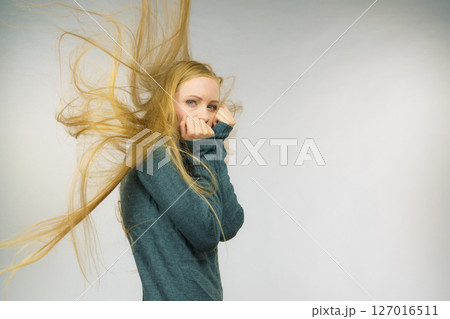 Sad girl with blowing hair Sad girl with blowing hair 127016511