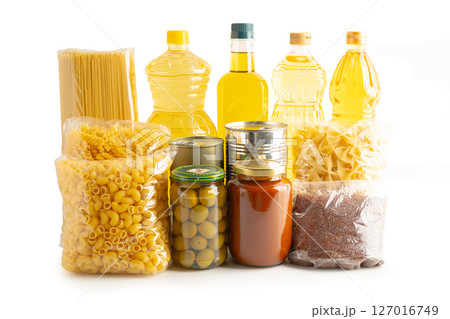 Foodstuffs in donation box isolated on white background with clipping path. Foodstuffs in donation box isolated on white background with clipping path. 127016749