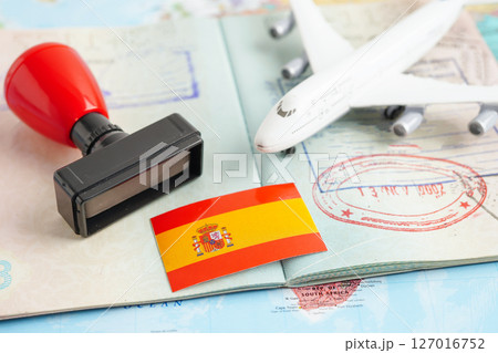 Spain flag and passport with airplane for travel. 127016752