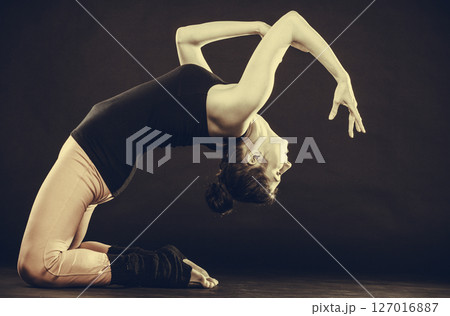 Fit girl stretching warming up. 127016887