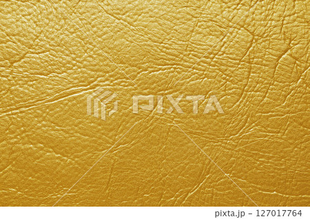 Close up, macro texture of yellow glossy natural genuine leather, leatherette structure 127017764
