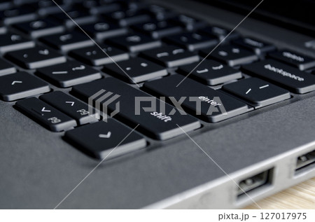 Close up of laptop keyboard and ports demonstrating physical access points for cyber threats. Close up of laptop keyboard and ports demonstrating physical access points for cyber threats. 127017975