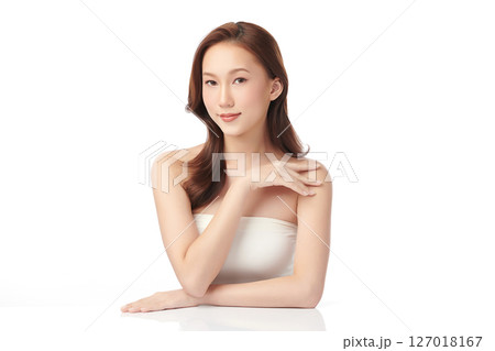 A beautiful young Asian woman with clean, fresh skin against a white background. Skincare, facial treatment, cosmetology, beauty, and spa. An elegant portrait of an Asian woman. A beautiful young Asian woman with clean, fresh skin against a white background. Skincare, facial treatment, cosmetology, beauty, and spa. An elegant portrait of an Asian woman. 127018167