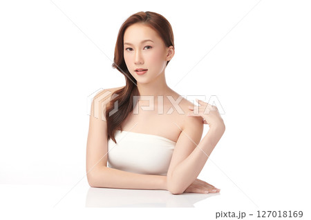 A beautiful young Asian woman with clean, fresh skin against a white background. Skincare, facial treatment, cosmetology, beauty, and spa. An elegant portrait of an Asian woman. A beautiful young Asian woman with clean, fresh skin against a white background. Skincare, facial treatment, cosmetology, beauty, and spa. An elegant portrait of an Asian woman. 127018169