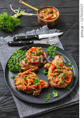 pork chops topped with bell pepper cream gravy pork chops topped with bell pepper cream gravy 127019337