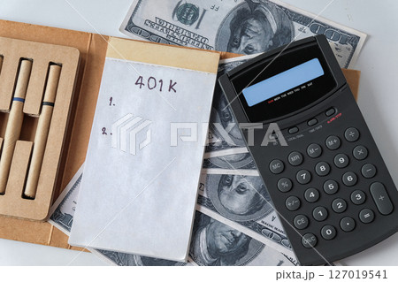 401k Plan note with egg and Pile of US Money. 401k Plan note with egg and Pile of US Money. 127019541