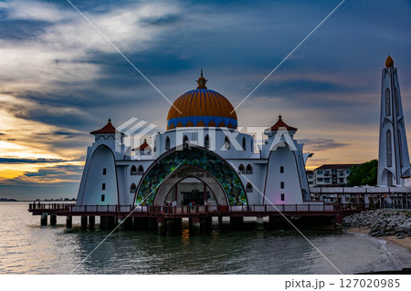 Bandar Melaka, Malaysia- April 16 2025.Masjid Selat Melaka is a landmark for tourist spot in Malacca.A landmark that attracts people to view the architecture landscape.The mosque is built on the sea. 127020985
