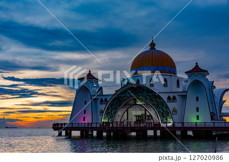 Bandar Melaka, Malaysia- April 16 2025.Masjid Selat Melaka is a landmark for tourist spot in Malacca.A landmark that attracts people to view the architecture landscape.The mosque is built on the sea. 127020986