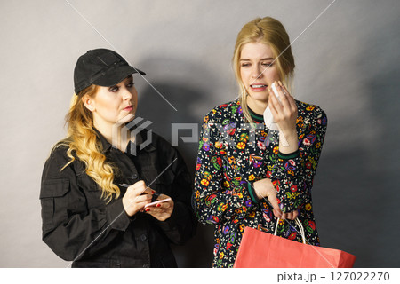 Security guard and shoplifter. Security guard and shoplifter. 127022270