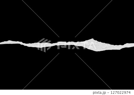 Ripped torn paper edges isolated on black background Ripped torn paper edges isolated on black background 127022974
