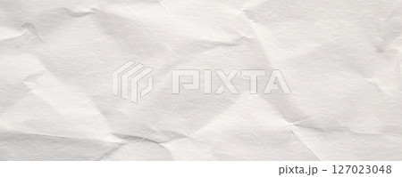 Abstract white crumpled and creased recycle paper texture background 127023048