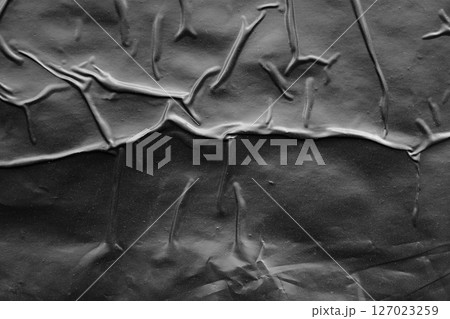 black crumpled and creased plastic poster texture background black crumpled and creased plastic poster texture background 127023259