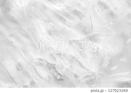 Transparent clear liquid serum gel cosmetic texture background Transparent clear liquid serum gel cosmetic texture background 127023269
