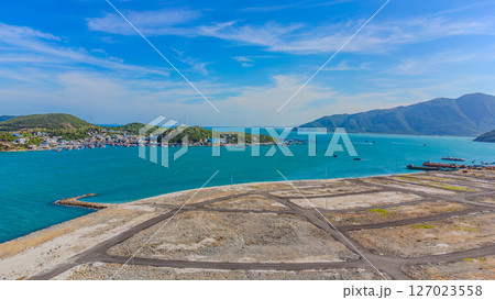 A construction site by the sea. 127023558