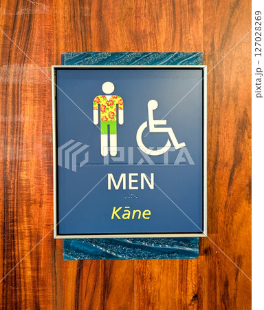 Male restroom sign in Hawaii with tropical decorations  127028269
