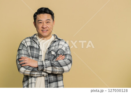 Happy Asian man smiling friendly glad expression feel satisfied concept good news celebrate win 127030128