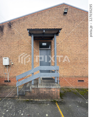 An old and dirty staircase entryway to a building An old and dirty staircase entryway to a building 127030295