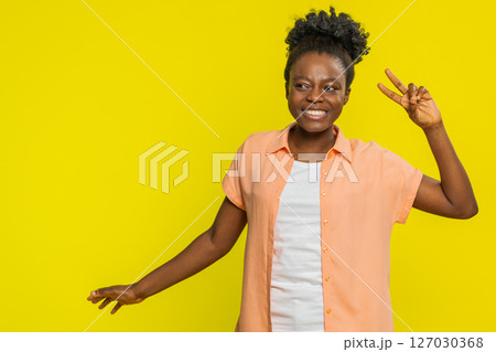 African American woman dancing with funny hand gestures, playful vibe cheerful rhythm joyful energy 127030368
