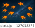 発光する金魚が星屑をまき散らしながら泳ぐ幻想的な夜空と海 発光する金魚が星屑をまき散らしながら泳ぐ幻想的な夜空と海 127038275