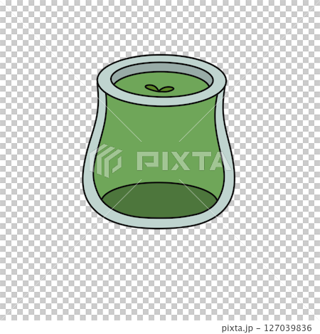A green glass jar with a green apple inside 127039836