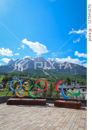 Cortina d'Ampezzo 2026 Olympic Rings with Scenic Dolomites View in Cortina d'Ampezzo, Italy. May 14, 2025 Cortina d'Ampezzo 2026 Olympic Rings with Scenic Dolomites View in Cortina d'Ampezzo, Italy. May 14, 2025 127041670