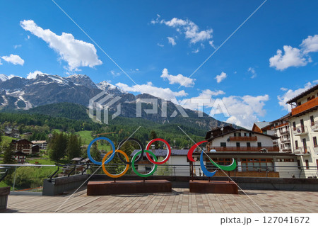 Cortina d'Ampezzo 2026 Olympic Rings with Scenic Dolomites View in Cortina d'Ampezzo, Italy. May 14, 2025 Cortina d'Ampezzo 2026 Olympic Rings with Scenic Dolomites View in Cortina d'Ampezzo, Italy. May 14, 2025 127041672