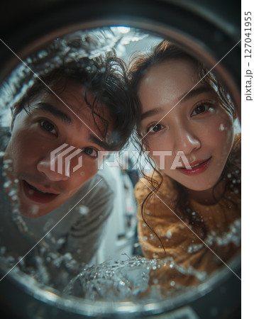 Enjoying a laundry day together with love and laughter in a cozy home 127041955