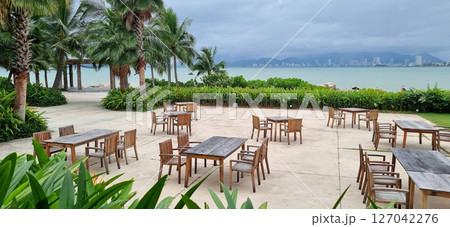 Outdoor Dining Area at Tropical Resort. Ocean View for Relaxation. 127042276