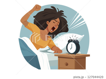 A sleepy woman doesn't want to wake up in the morning. She is angry at her alarm clock. 127044420