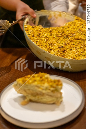 Pistachio Tiramisu served on plate in the restaurant 127044759