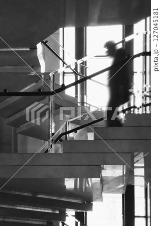 Spiral staircase interior building Architecture details with people walk down stairs Silhouette shadow Spiral staircase interior building Architecture details with people walk down stairs Silhouette shadow 127045181