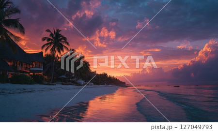 Vibrant Sunset Over Tropical Beach with Palm Trees 127049793
